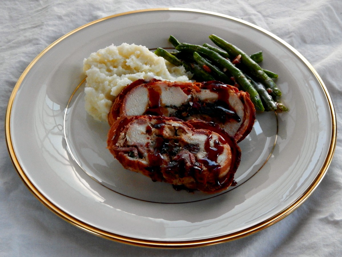 Bacon Wrapped Stuffed Chicken Roast: Chicken breast stuffed with sausage, cheese, spinach and port soaked dried cherries, all rolled up and wrapped in bacon!
