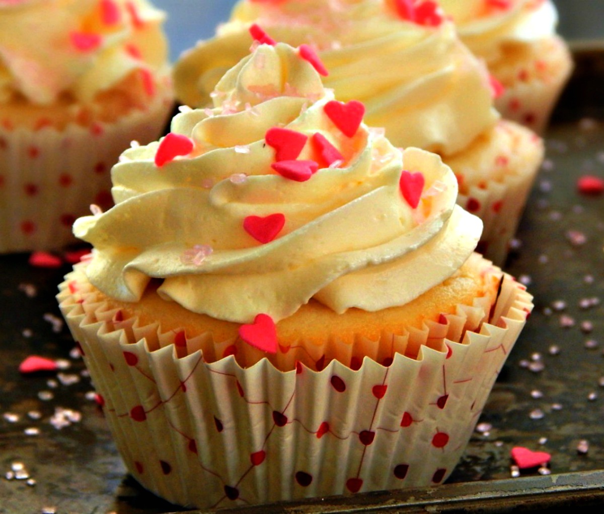 Raspberry filled Vanilla Cupcakes with White Chocolate Buttercream Frosting.