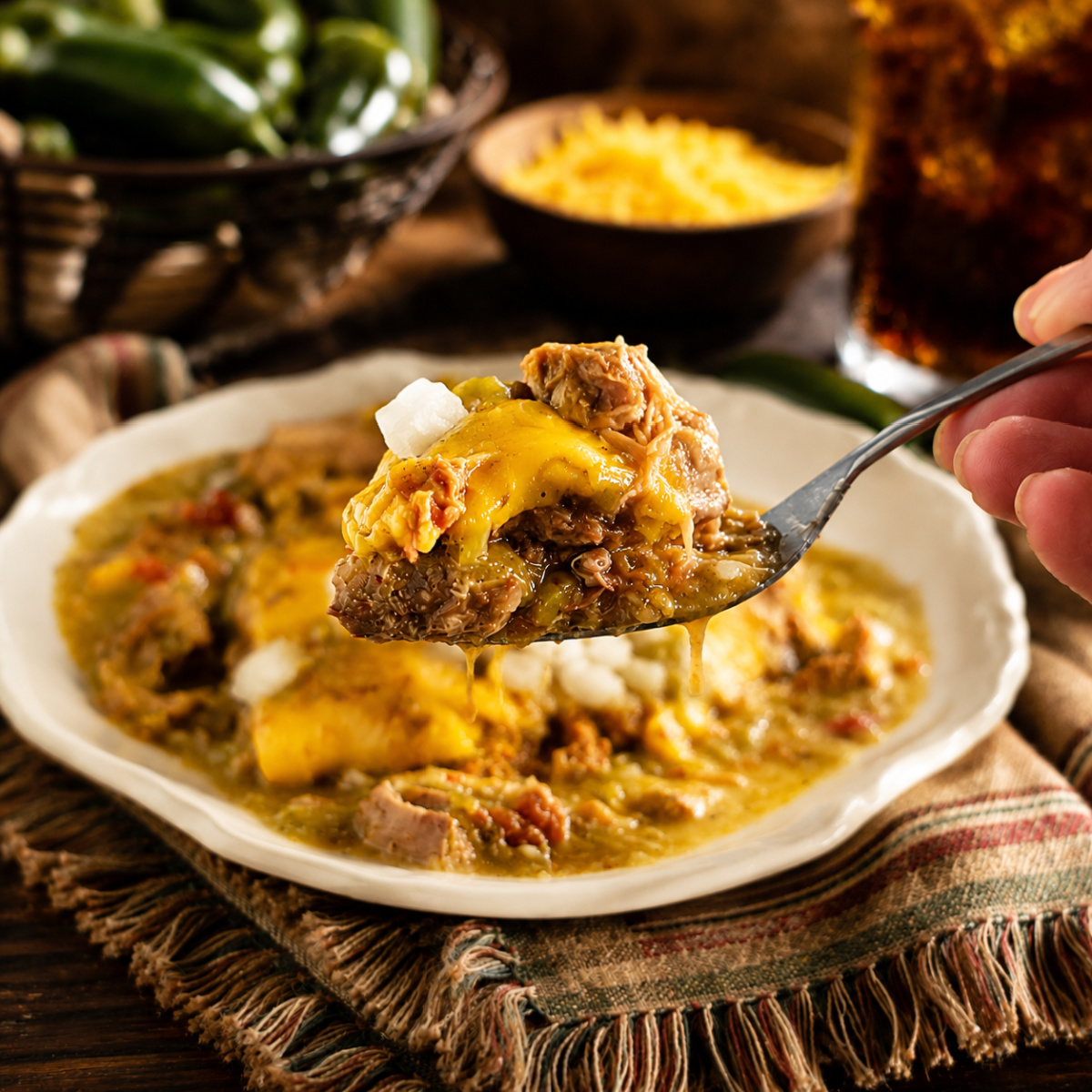 The Pueblo Slopper - a burger on a bun, topped with cheese and drenched in Colorado Green Chili.